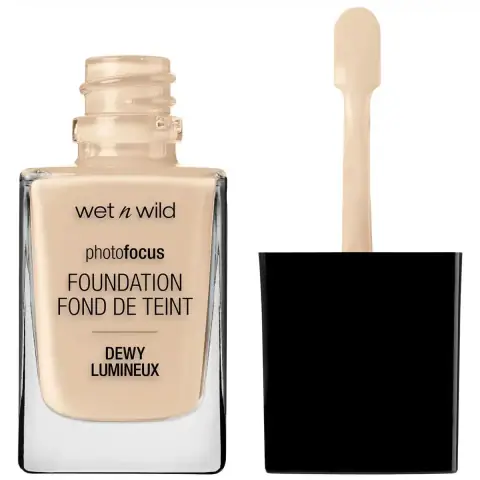 Wet N Wild PhotoFocus Dewy Foundation Soft Ivory clear glass bottle with a white pump dispenser.