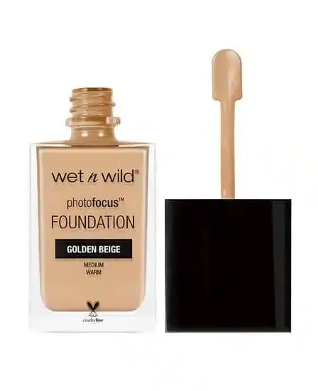 Clear glass bottle of Wet N Wild Photo Focus Matte Foundation, Golden Beige, with pump dispenser.