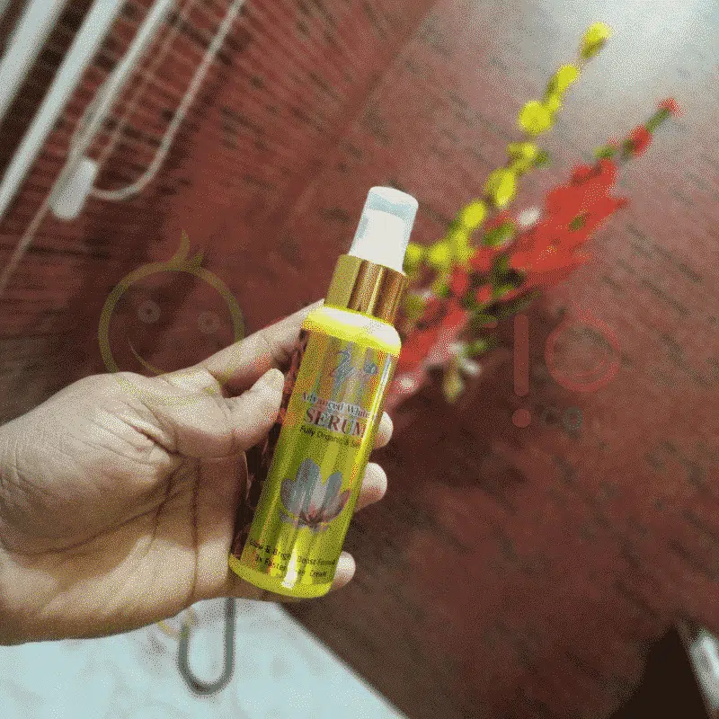 Two Zafran Whitening Serum gold bottles, slightly angled, showcasing the packaging from different perspectives. - thumbnail