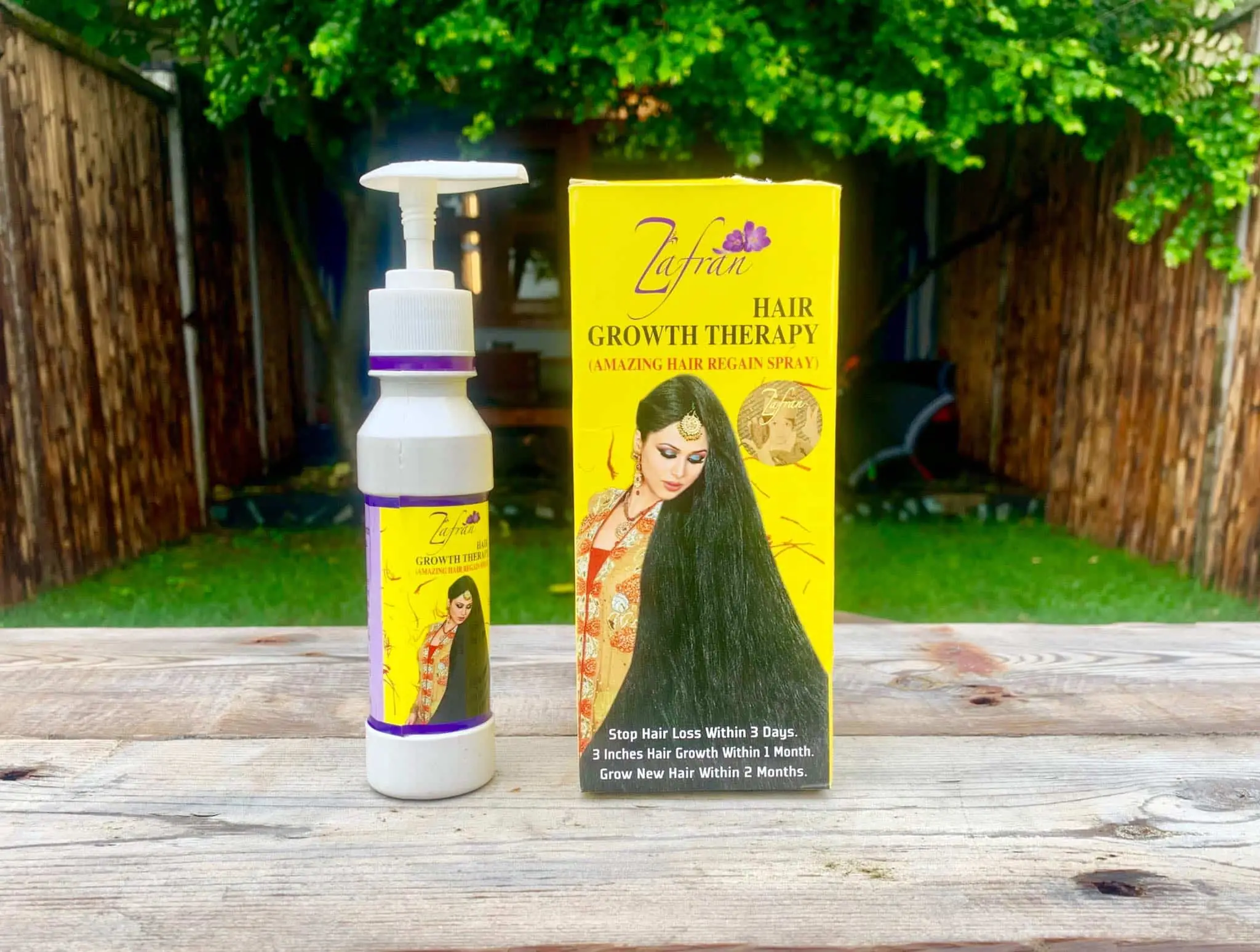 Two Zafran Hair Growth Therapy oil bottles, showing detailed product labels against a white background. - thumbnail